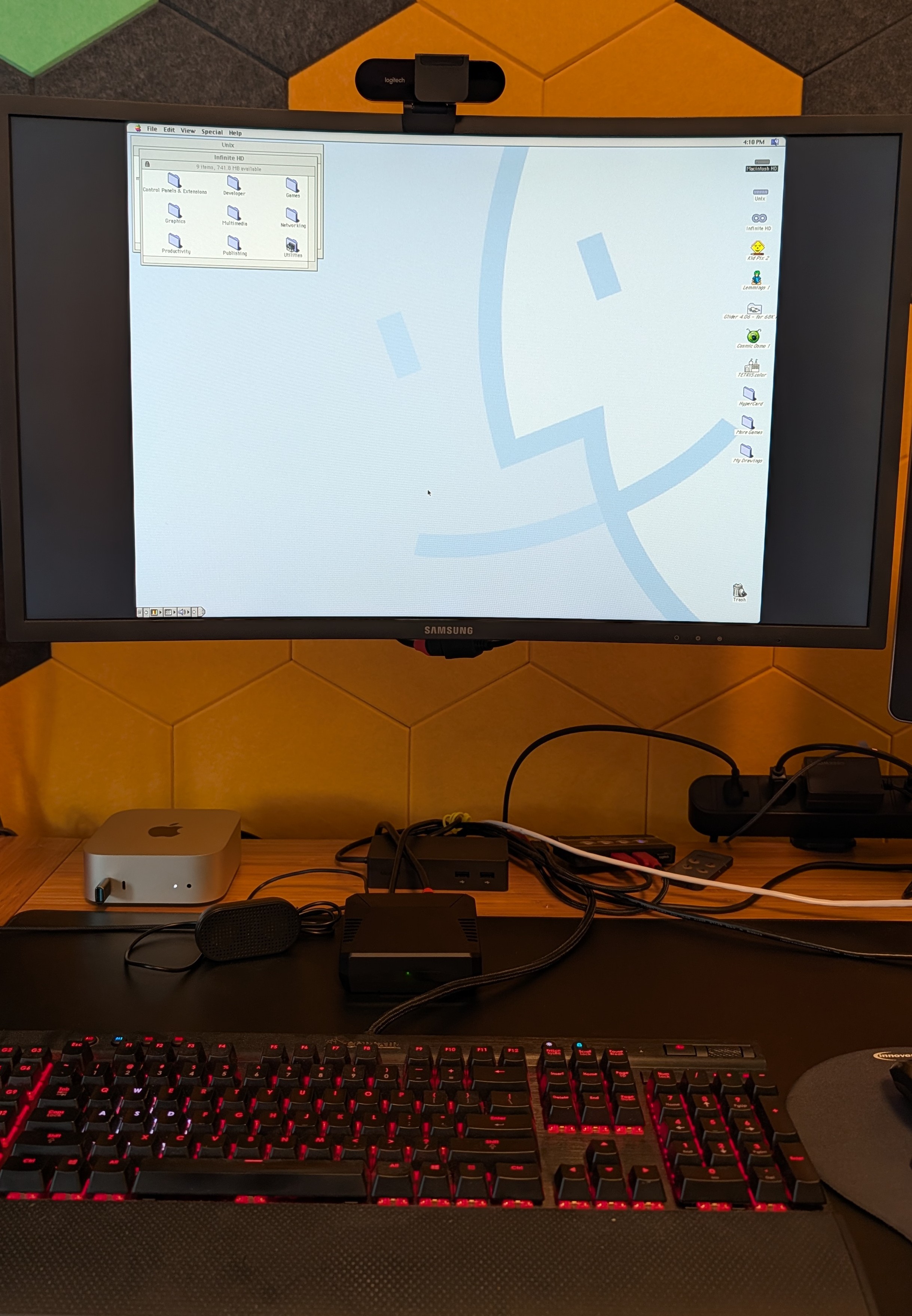 Chimebox in operation: Raspberry Pi 5 in an Argon ONE V3 case, driving a small monitor showing the Mac OS 8.1 Desktop